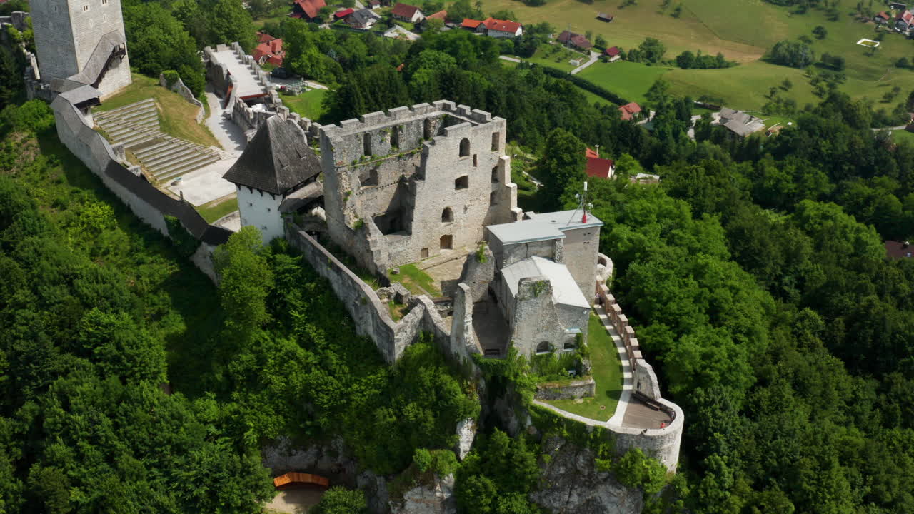 High-angle aerial shot of Celje Castle’s medieval stone walls