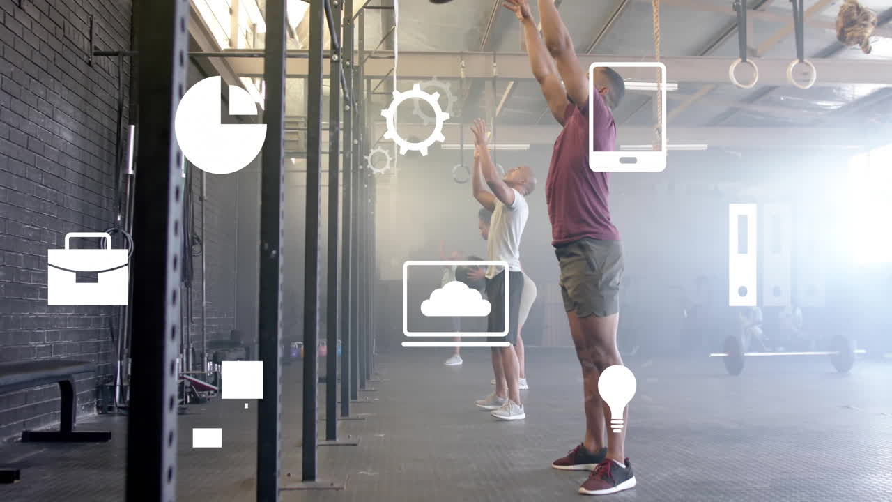In gym, people exercising with animation of technology icons overlaying scene
