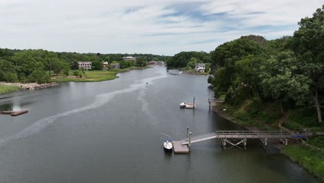 an aerial view over the saugatuck river in connecticut on a beautiful day with blue skies and white clouds