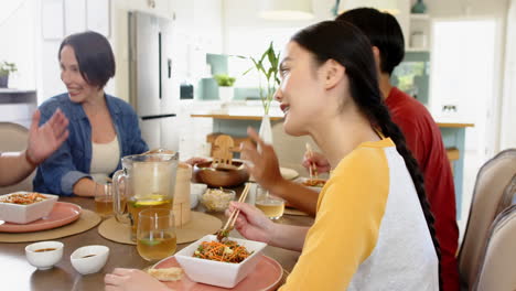 Eating together, family enjoying meal and conversation at dining table