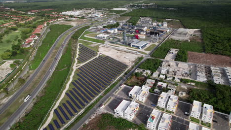 aerial view of residencial selenev development next to cepm energy plant with rows of solar panels