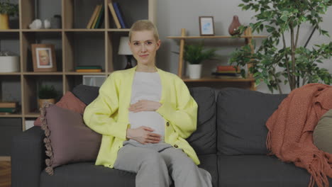 pregnant woman relaxing at home