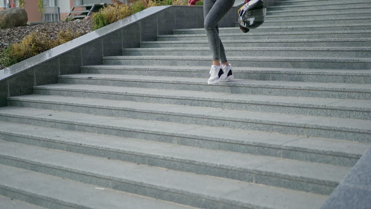 Girl sitting on motorcycle. Beautiful biker girl sitting on superbike outside