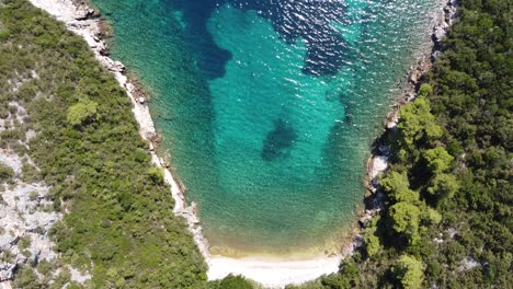 Aerial-Drone-View-of-the-Turquoise,-Crystal-Clear-Adriatic-Sea-along-the-coast-of-Dalmatia,-Croatia