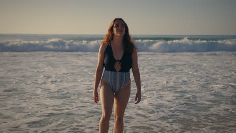 girl-walking-away-from-the-sea-full-shot-slow-motion