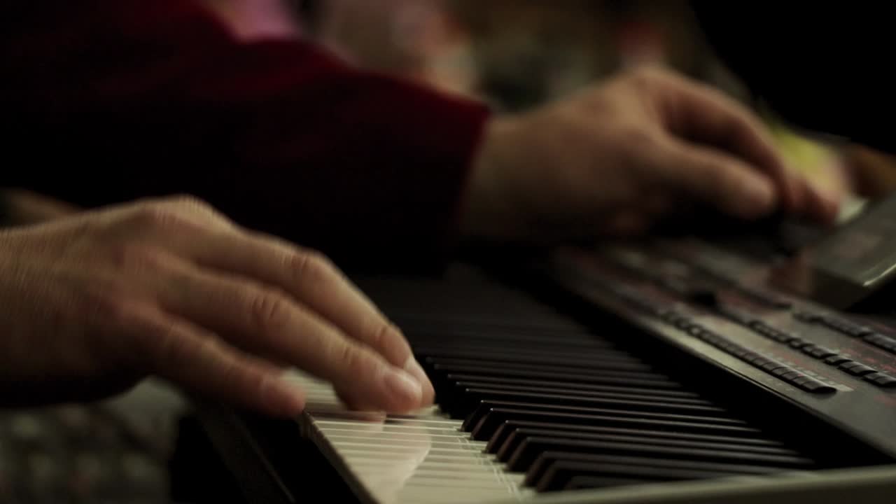 Hands on the organ close up