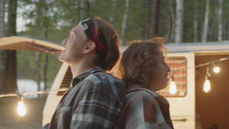 Happy-Man-and-Woman-Dancing-at-Campsite