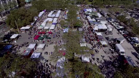 4k aerial drone video of shoppers at saturday morning market in downotwn st