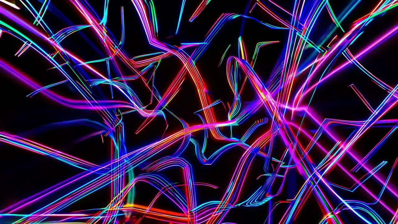 Bright neon light trails in various colors intertwine and overlap, forming a dynamic and vibrant abstract composition against a dark backdrop, creating a sense of energy and movement