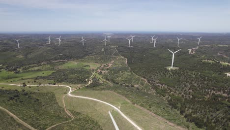 Approaching-aerial-shot-of-a-wind-farm-in-Barao-de-Sao-Joao,-Portugal