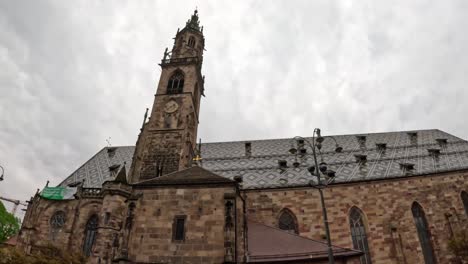 assumption of our lady cathedral - bolzano parish church - waltherplatz main square in bolzano, italy. tilt-down shot