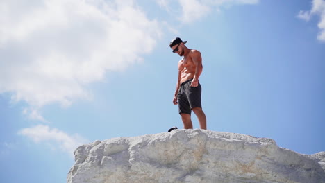 sportive man training outdoors. view of sportrtive man on top of mountain