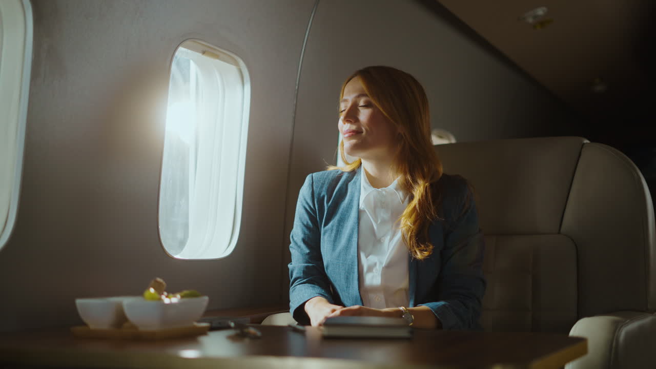 Businesswoman traveling on a private jet