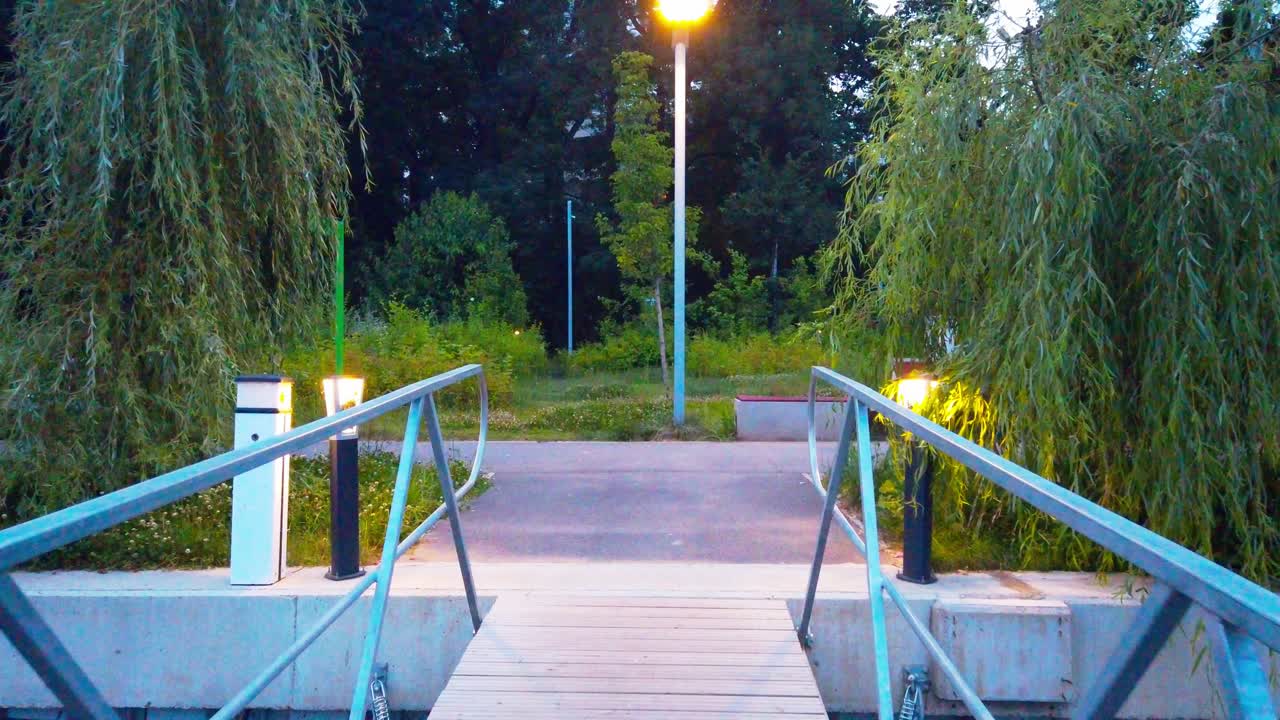 Walking on a pontoon on lake.Wooden structure on water