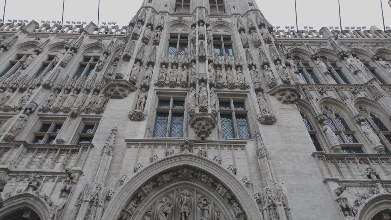 Intricate Gothic design of Brussels Town Hall facade on Grand Place, a UNESCO World Heritage Site