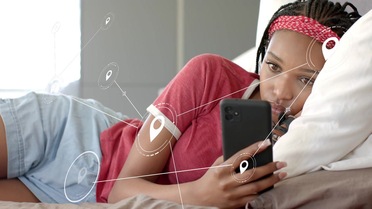 Woman reclining bed tapping phone, creating map pins and links expanding across bed for navigation