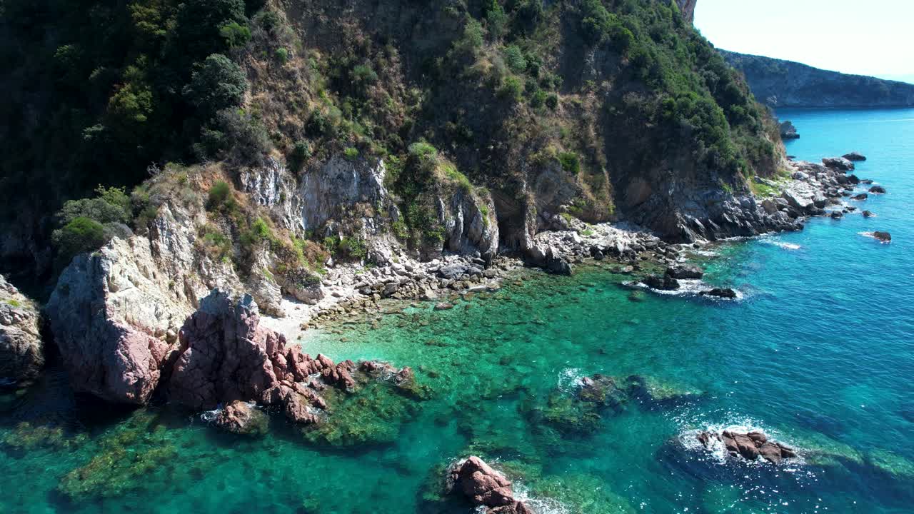 Ionian Riviera Landscape with Rocky Hills Cape Descending into Deep Turquoise Blue Sea Albania