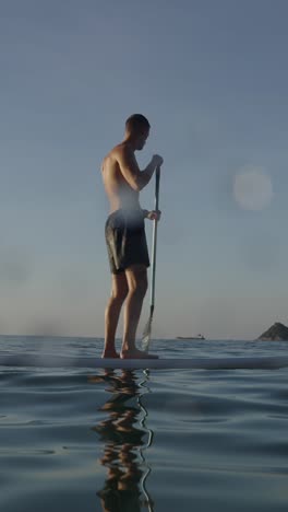 man paddleboarding on the sea
