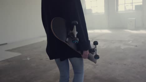 Fashionable-young-woman-in-an-abandoned-warehouse