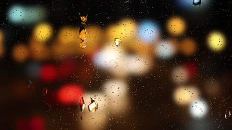 gota de agua en las ventanas con fondo desenfocado nocturno