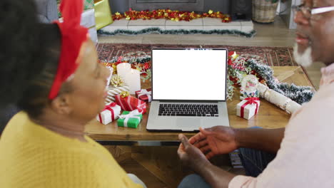 senior african american couple using laptop for video call with copy space