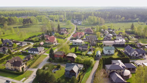 Private-homes-of-Balozi-township-in-Latvia,-aerial-drone-view