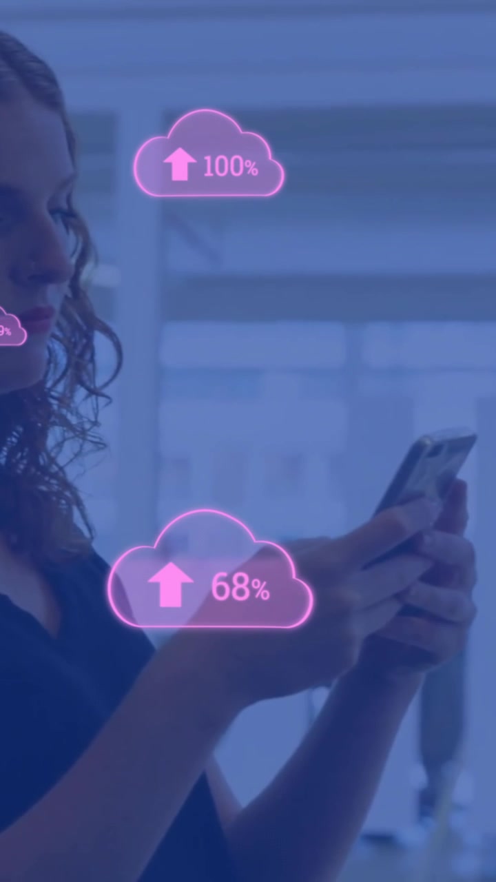Animation of cloud icons with growing number over caucasian businesswoman using smartphone