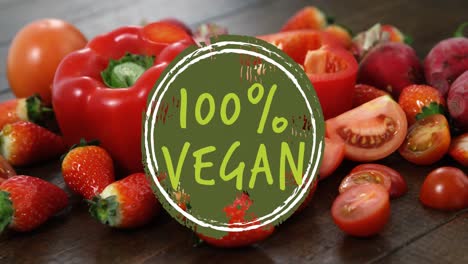 animación de texto vegano sobre frutas y verduras rojas frescas