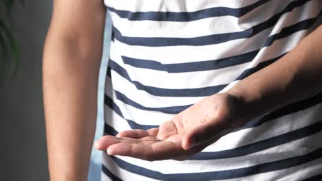 person applying hand sanitizer