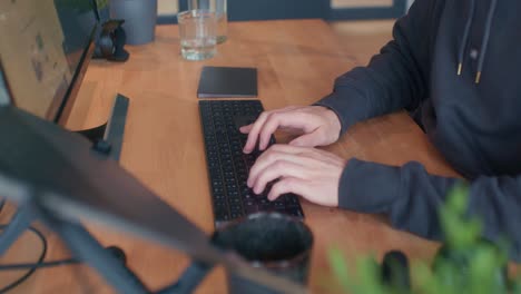 person typing on the computer inside the office