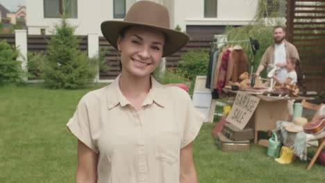portrait of happy woman posing in hat outdoors