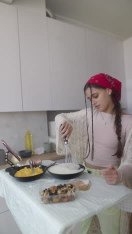 teenager cooking in a kitchen