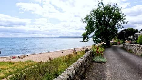 a peaceful road by the sea in fife