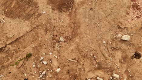 construction debris and waste on a dirt surface