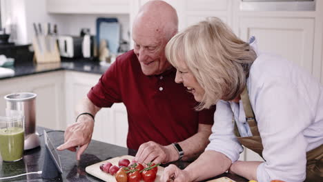 elderly couple cooking in the kitchen