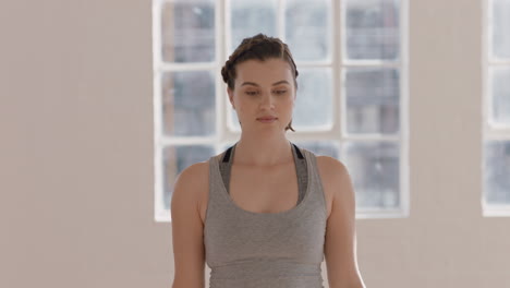 yoga class healthy caucasian woman practicing warrior pose enjoying fitness lifestyle exercising with multi ethnic people in workout studio