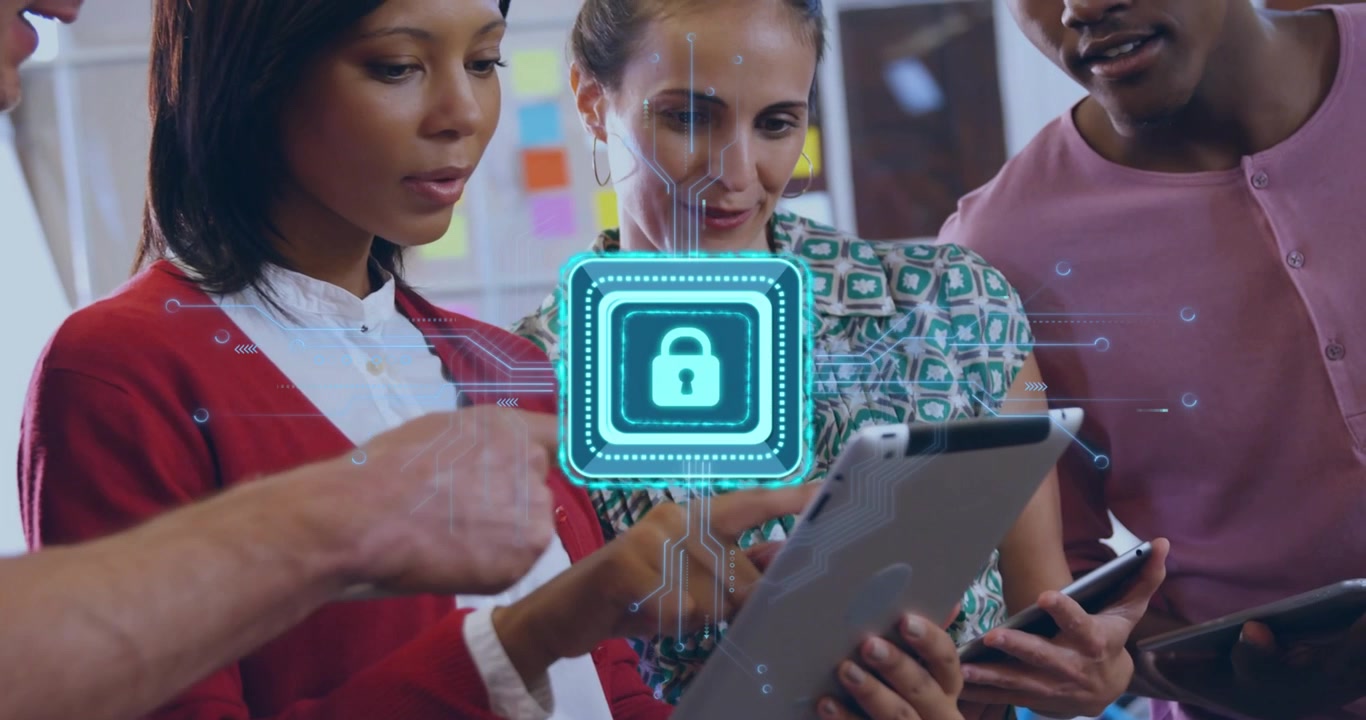 Diverse Team Collaborating on Digital Security Project in Office