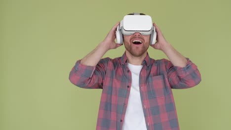 surprised man in virtual reality headset on yellow in studio. surprised man in virtual reality headset on yellow in studio. use of artificial intelligence technologies. video