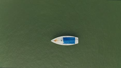 seafront solitary boat topdown view dji mavic 2 pro