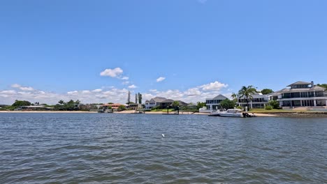 luxury homes and skyline along the river