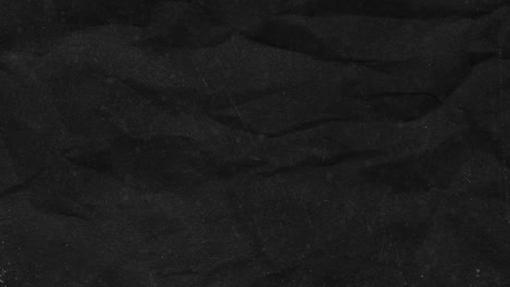 animación de papel desmenuzado contra un fondo negro
