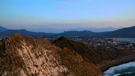 cinematic revealing drone shot of kyushu japan's rocky coastline