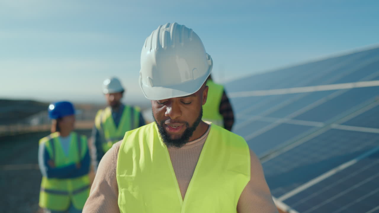 Engineers Inspecting Solar Panels