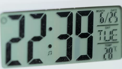 digital clock changing minutes time closeup view