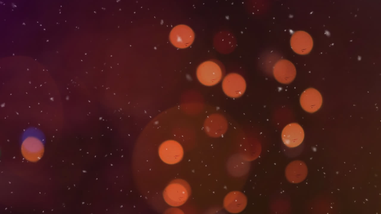 animación digital de la nieve cayendo sobre manchas de luz naranja contra un fondo negro