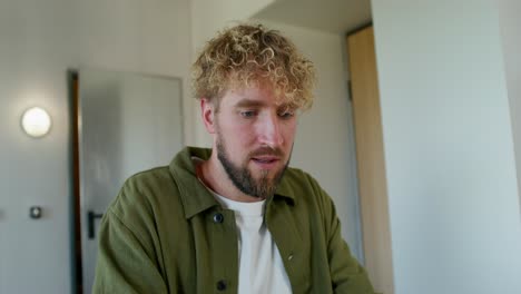 man working on laptop at home