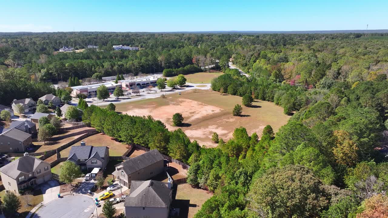 South Fulton housing development land surrounding townhomes and condos, wooded area, Butner road, Springbox Dr, Fairburn, Atlanta, Georgia, Aerial