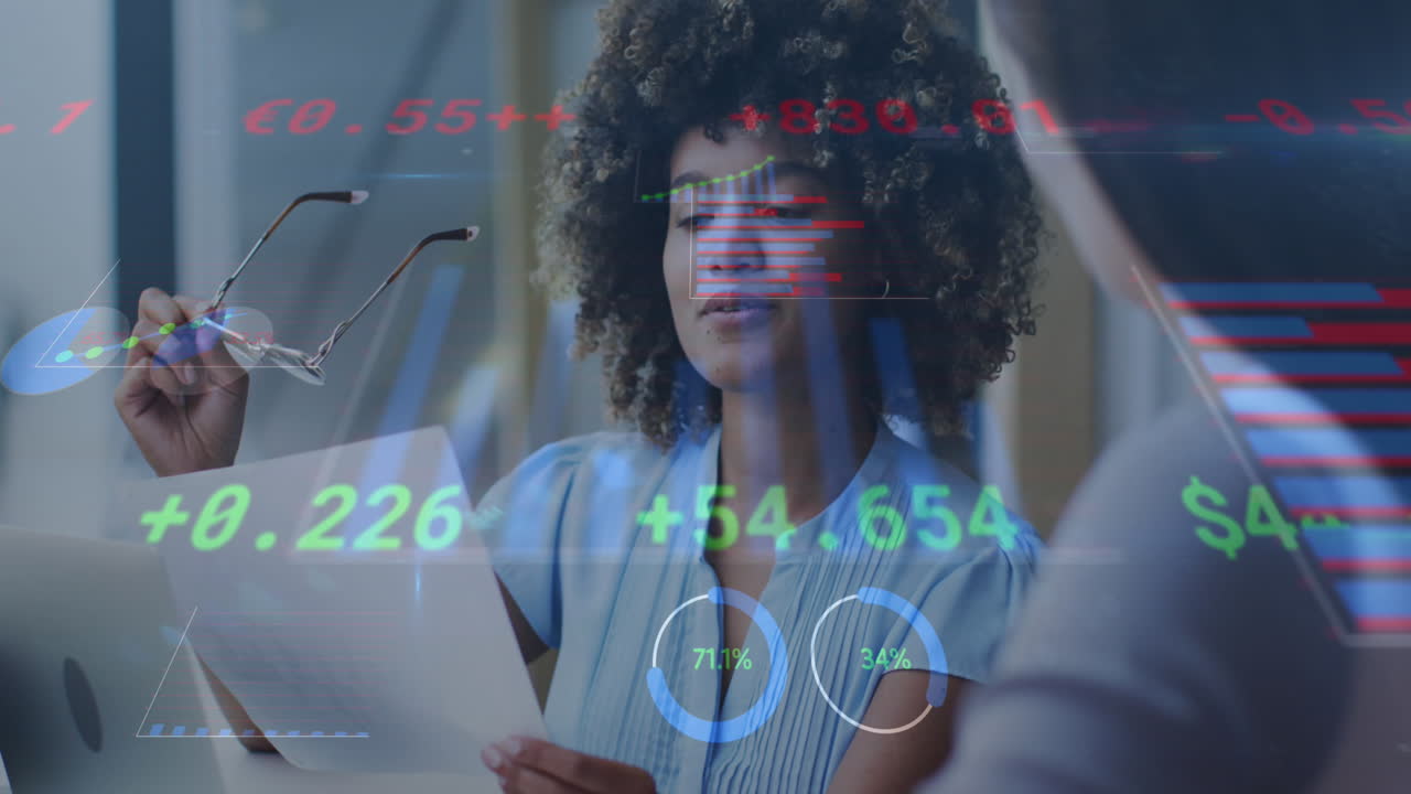 Animation of data processing over diverse businesswomen talking