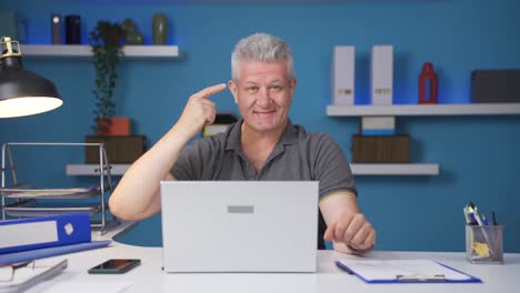 Home-office-worker-man-expressing-his-mind-and-success-to-the-camera.