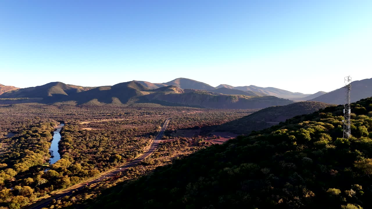 Communication tower on mountain for connectivity in remote isolated areas, drone
